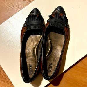 Born leather and dried pony hair loafers.